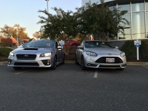 2015 Subaru WRX next to Ford Focus ST