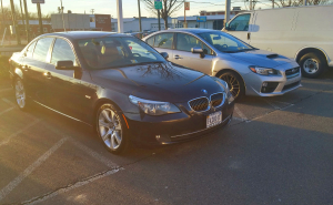 BMW 535i and Subaru WRX at Dealership