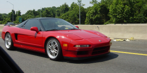 Rolling shot of Josh Taylor's red Acura NSX on the highway