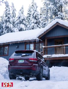 Jeep Grand Cherokee Trailhawk in snowy driveway