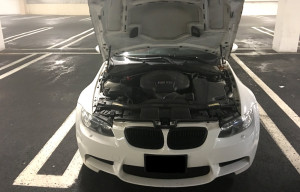 Hood open on 2008 BMW M3 showing the S65 V8 engine