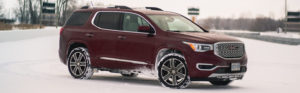 2017 GMC Acadia in red on snow