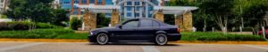 Carbon Black 2002 BMW M5 side shot