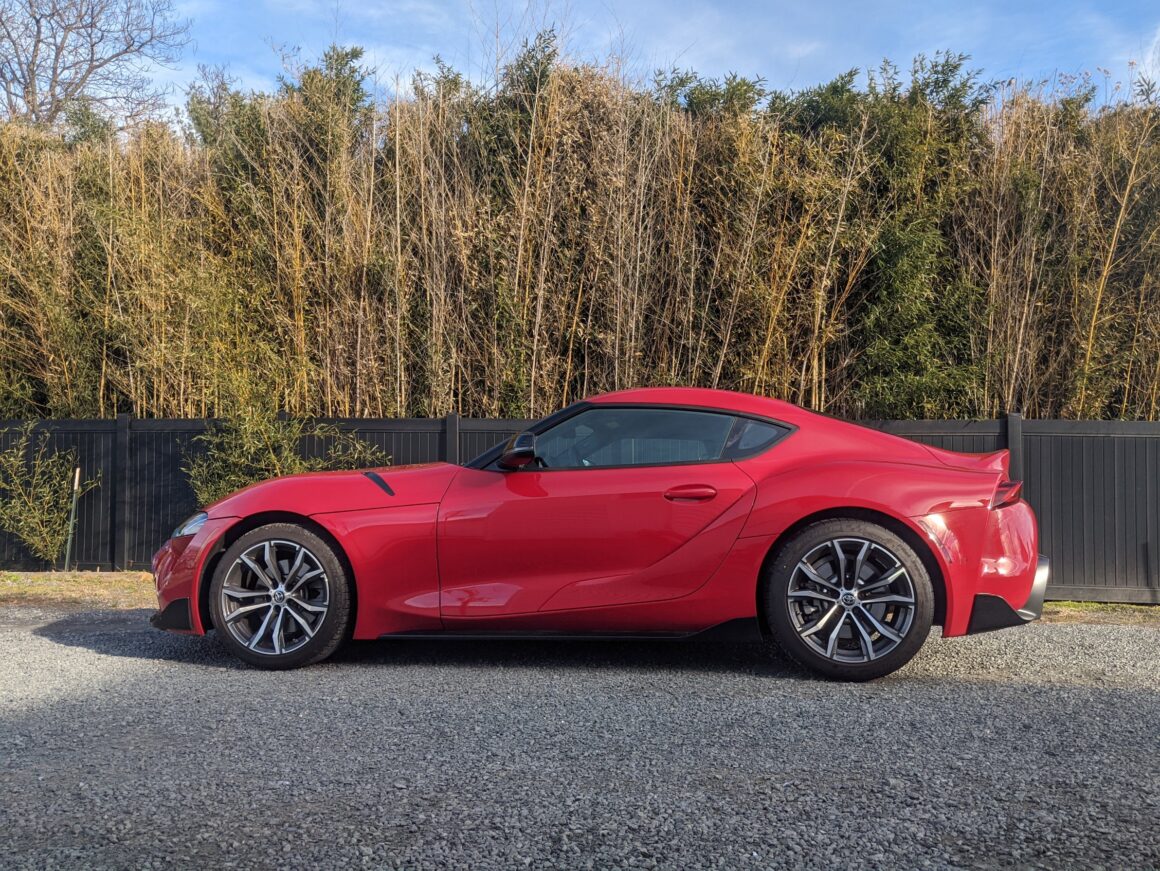 Red 2021 Toyota GR Supra 2.0 in front of bamboo